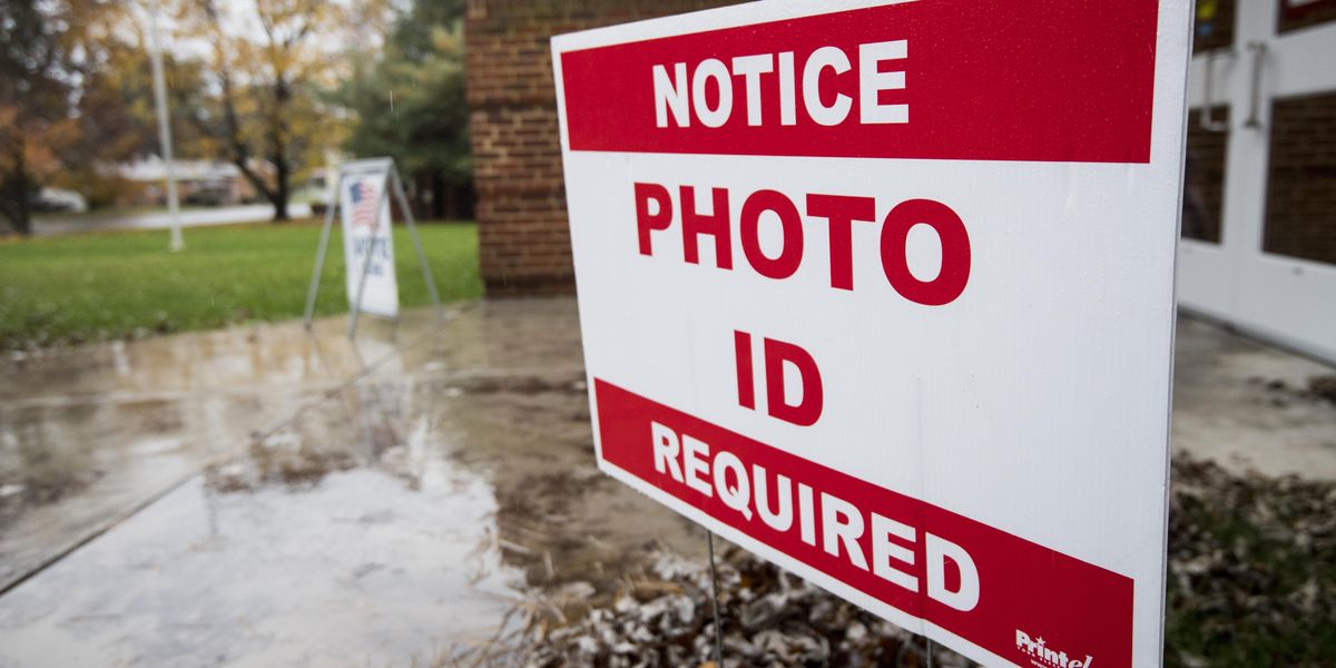 "Photo ID required" sign