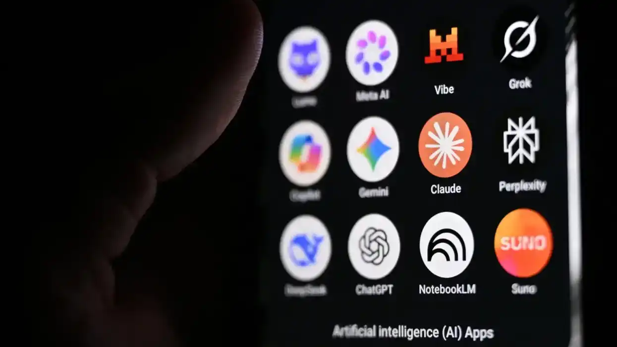 photograph shows a handheld smartphone displaying the icons of some of the main artificial intelligence based apps