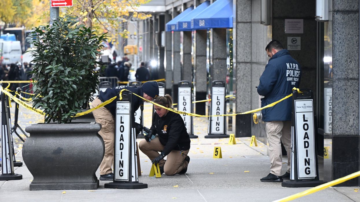 Police working on a sidewalk