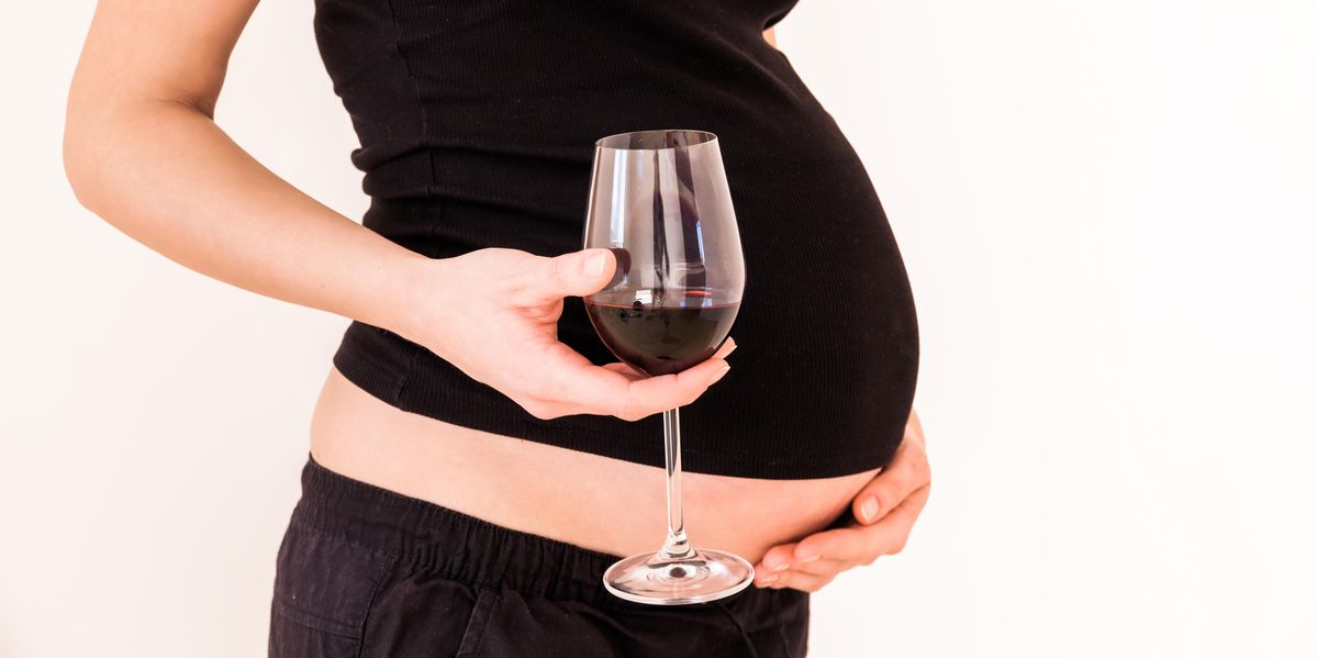 pregnant woman with wine