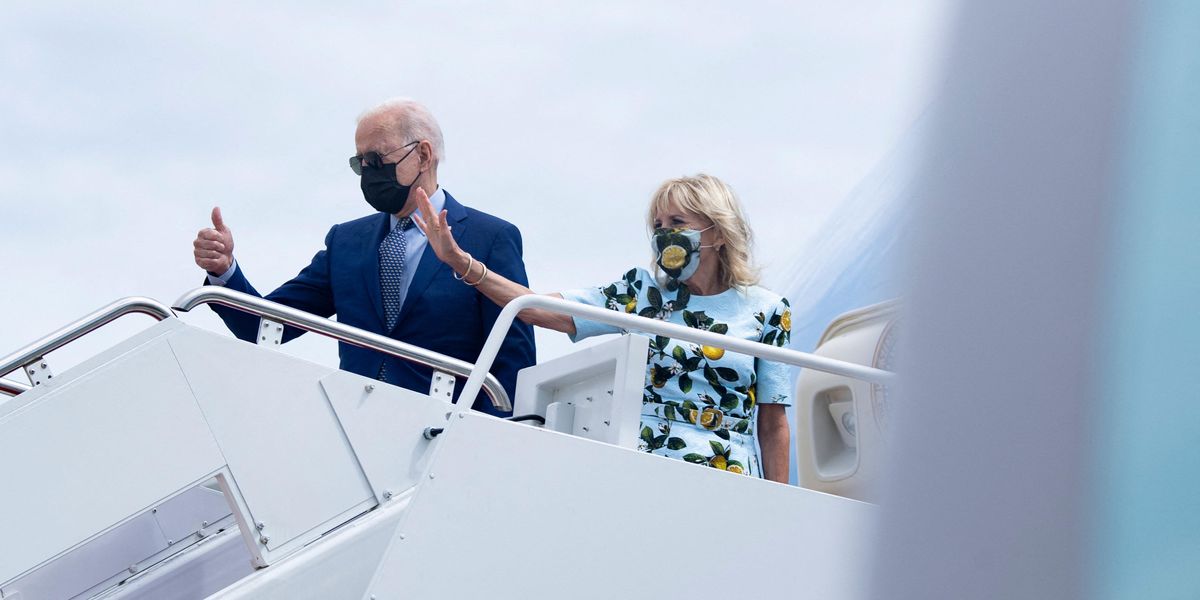 ​President Biden and first lady Jill Biden board Air Force One for a flight to Georgia on Thursday.