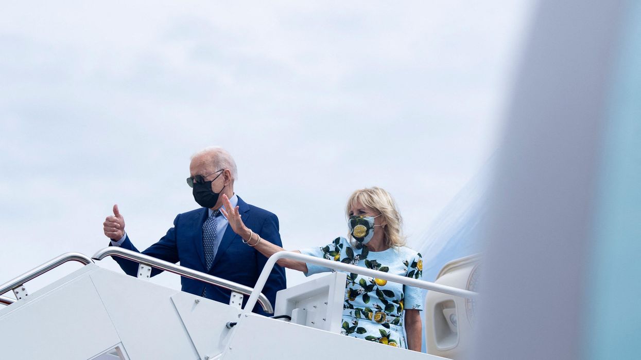 President Biden and first lady Jill Biden board Air Force One for a flight to Georgia on Thursday.