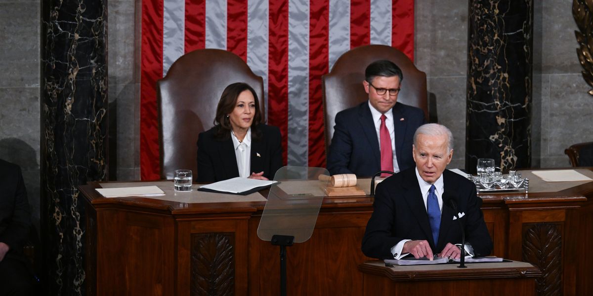 President Biden speaking in the House chamber, with Vice President Kamala Harris and Speaker Mike Johnson behind him