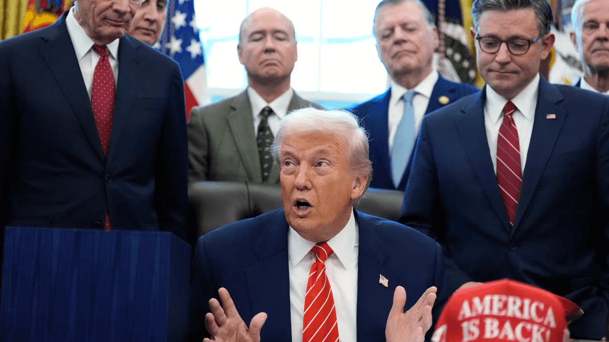 President Donald Trump and other officials in the Oval office.