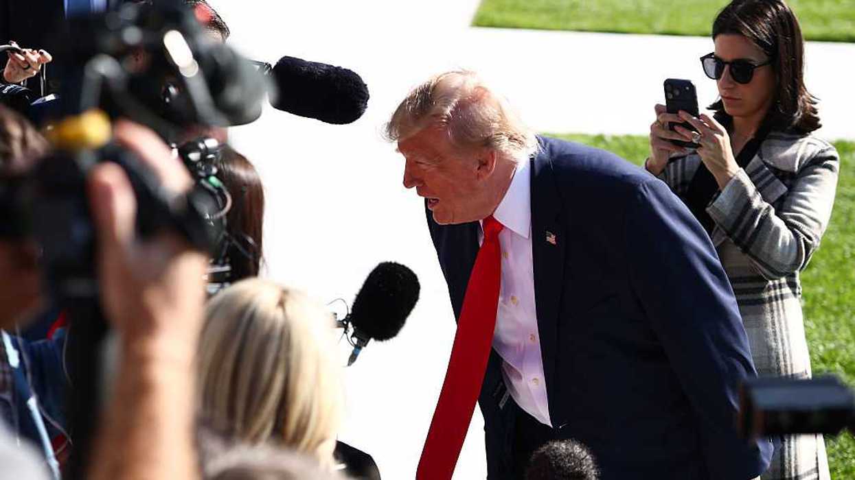 President Donald Trump speaks to members of the media