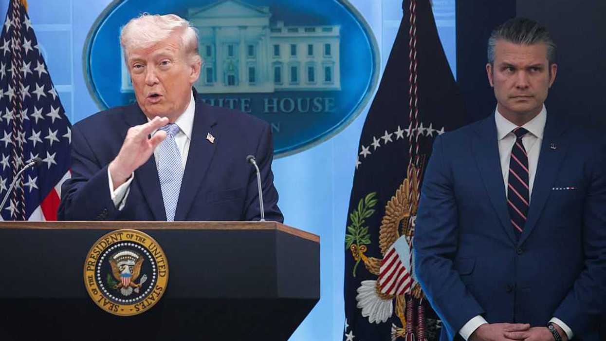 President Trump and U.S. Secretary of War Pete Hegseth standing next to each other at a news conference.