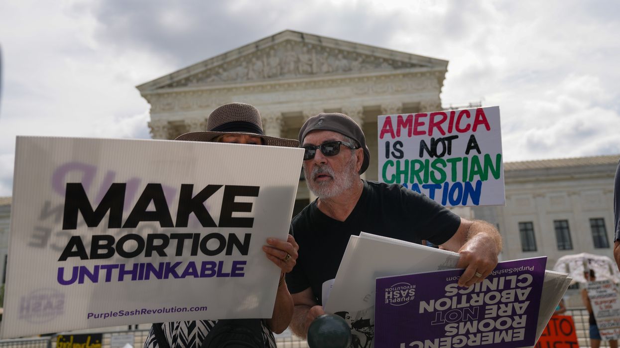 Protesters holding signs