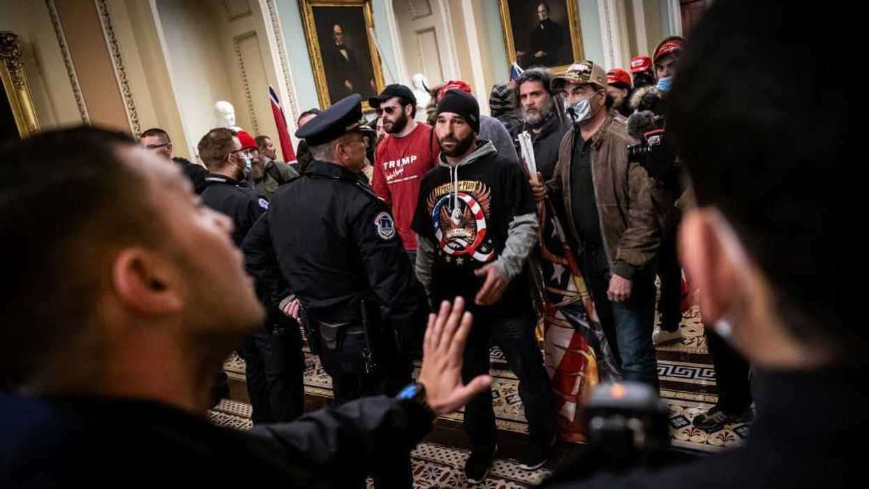 Protesters interact with Capitol Police inside the U.S. Capitol Building on January 6, 2021.