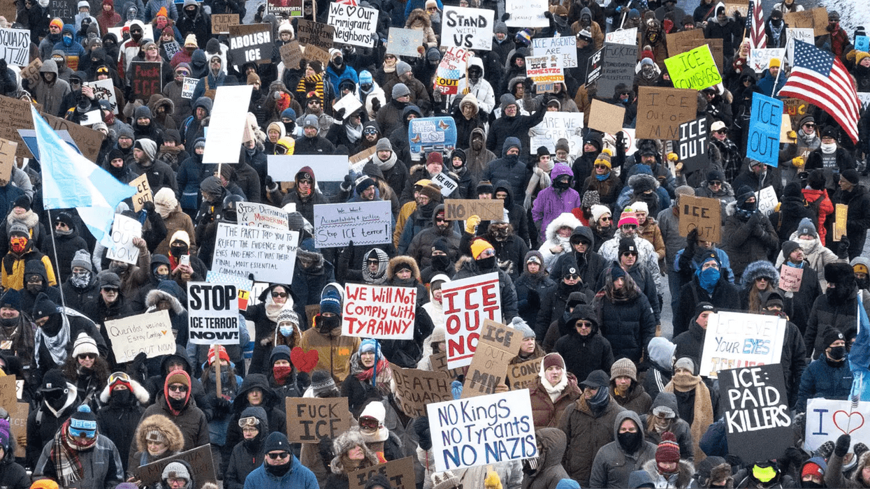 Protestors holding signs.
