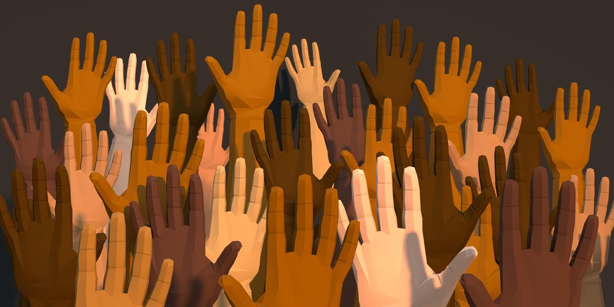Raised hands with diverse skin tones