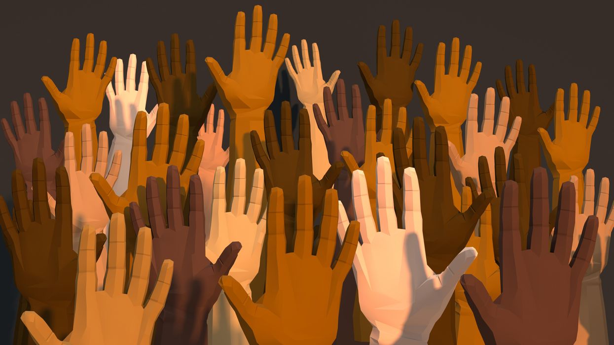 Raised hands with diverse skin tones