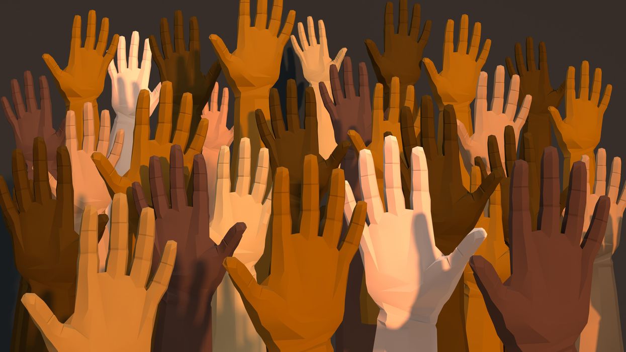 Raised hands with diverse skin tones