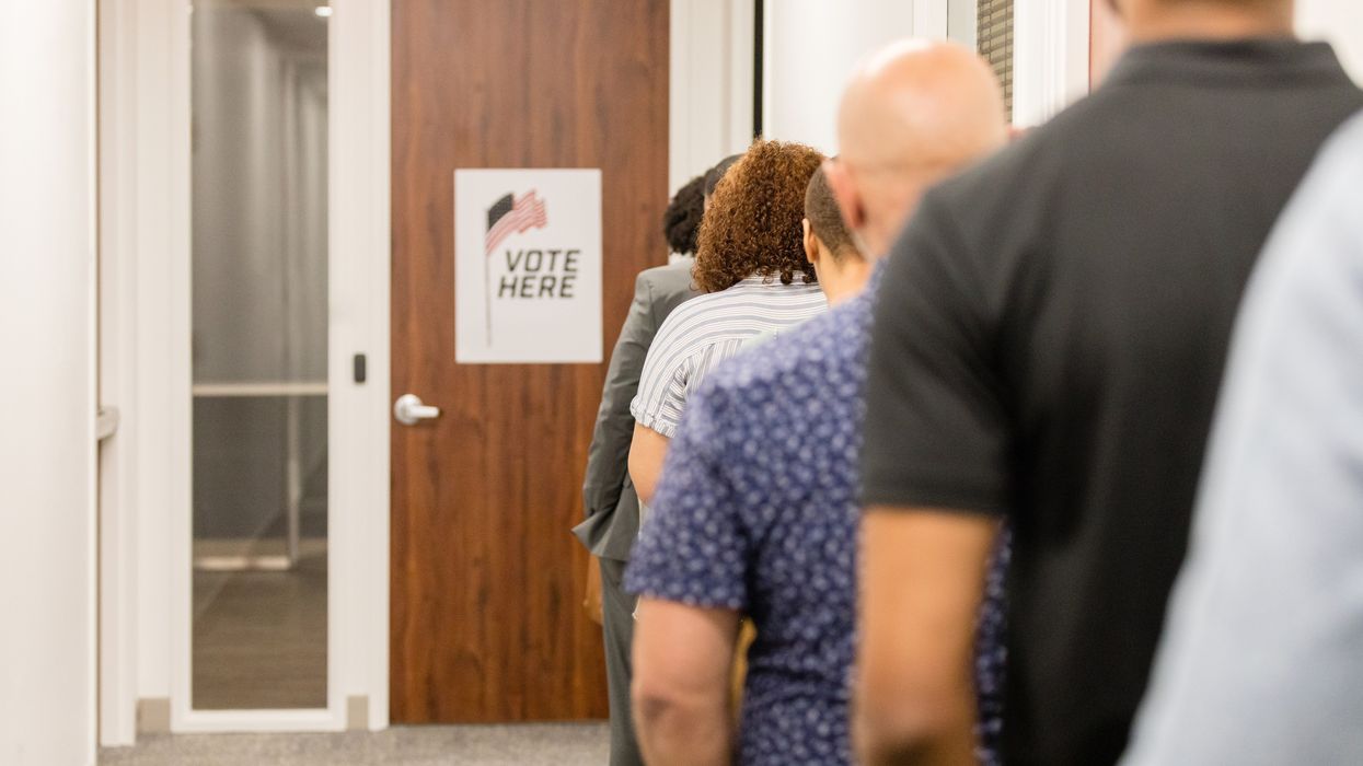 Rear view diverse voters waiting for polling place to open