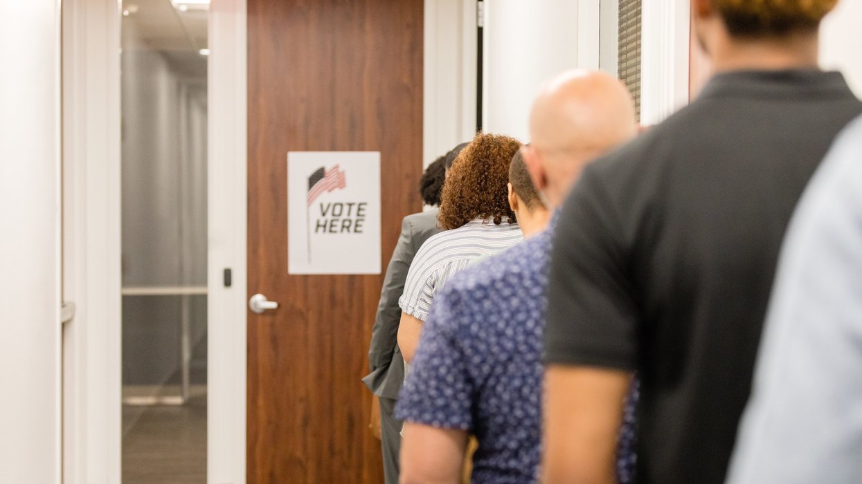 Rear view diverse voters waiting for polling place to open