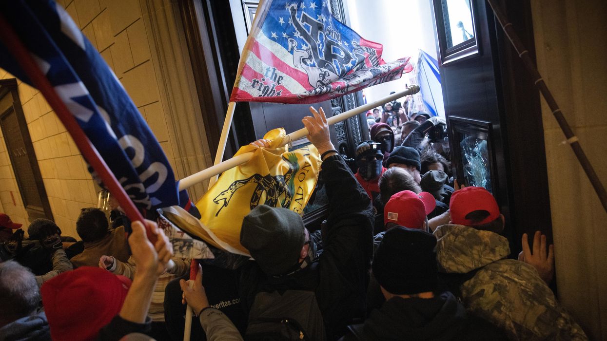 Rioters breaking into the Capitol
