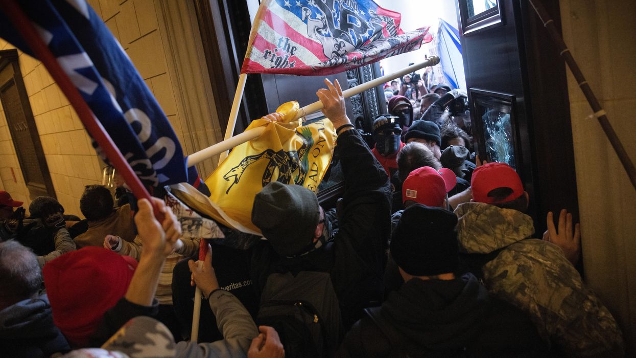 Rioters breaking into the Capitol
