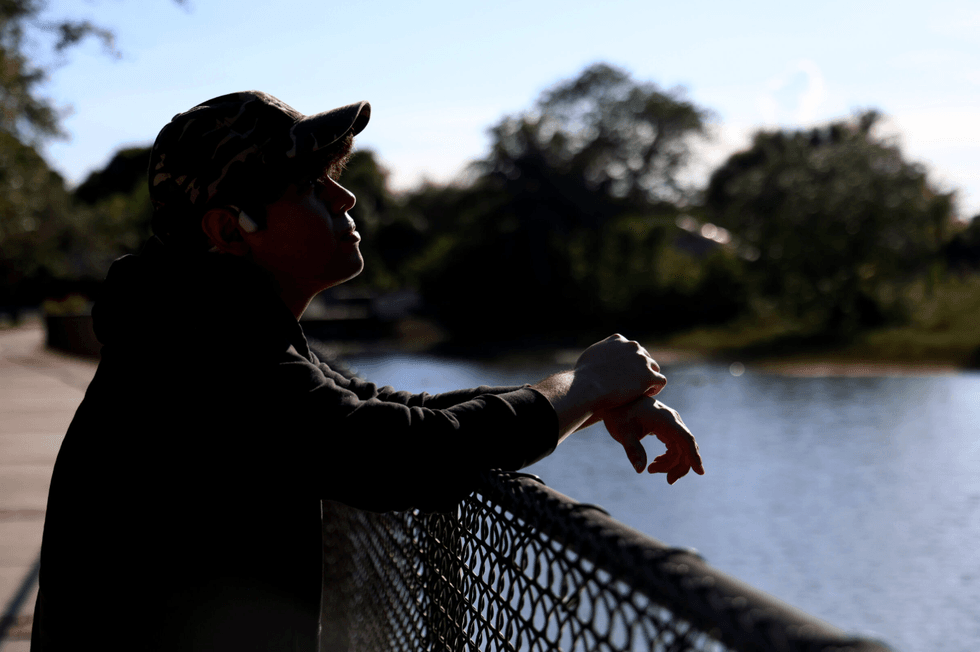 Sebastian, an architect from Valencia, Venezuela, who obtained TPS in 2023, poses for a photo in Sunrise, Florida