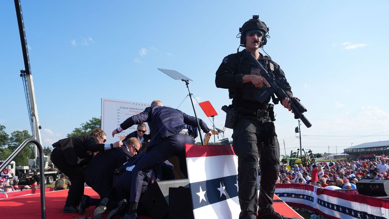 Secret Service agents covering Trump