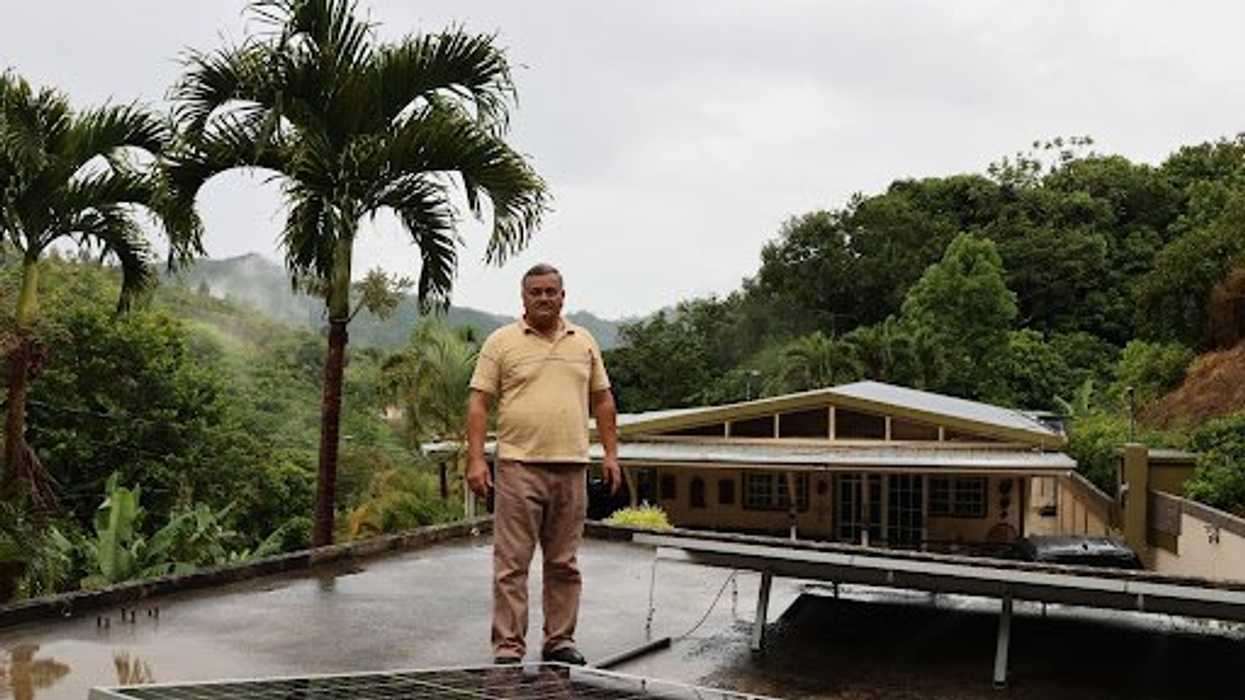 Serafin Sierra Torres with his rooftop solar panels