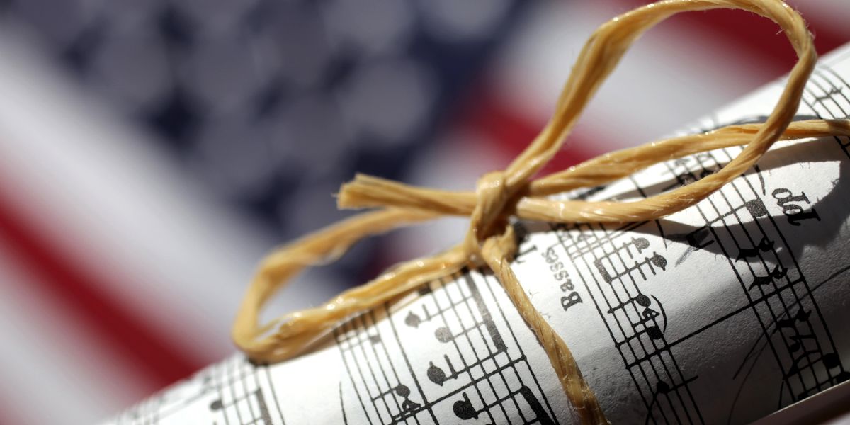 Sheet music in front of an American flag