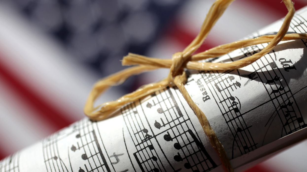 Sheet music in front of an American flag