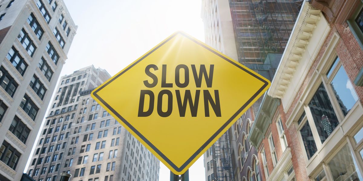 Sign saying "slow down"