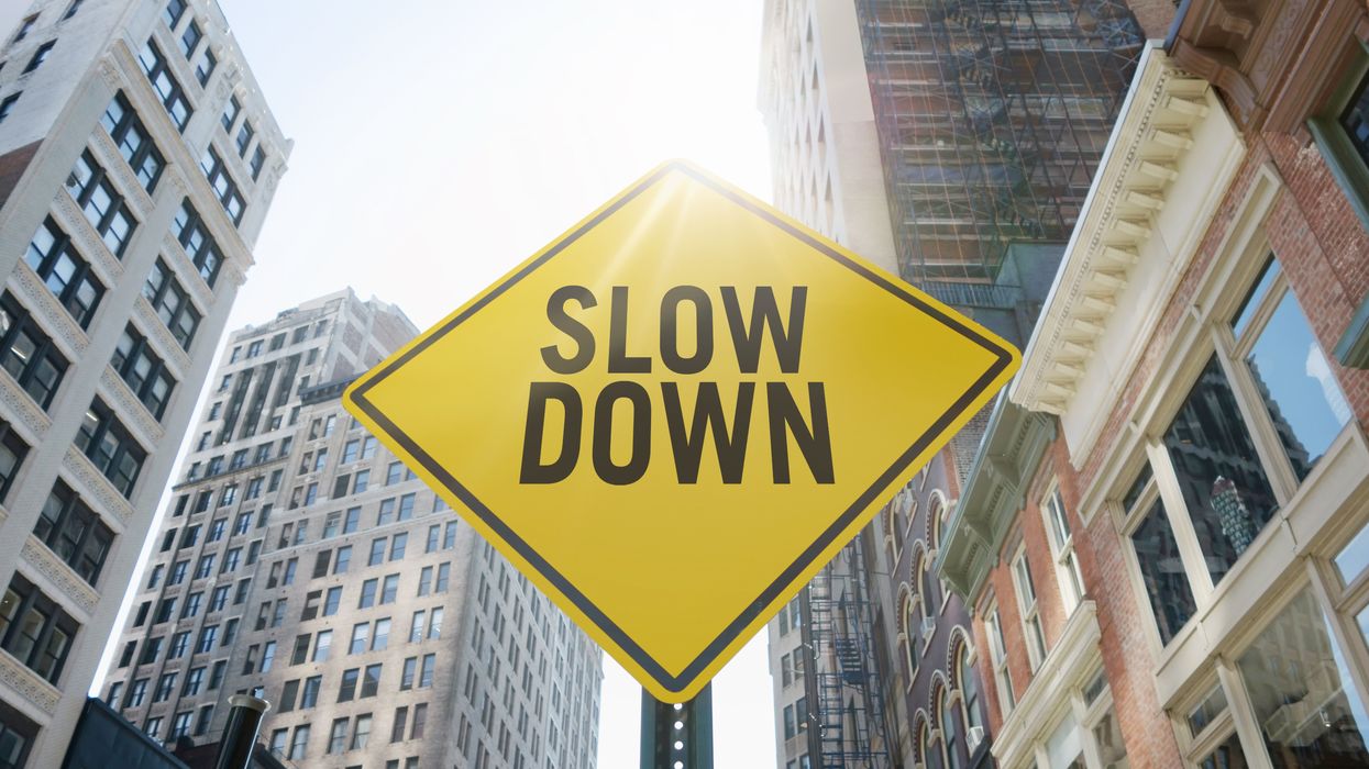 Sign saying "slow down"