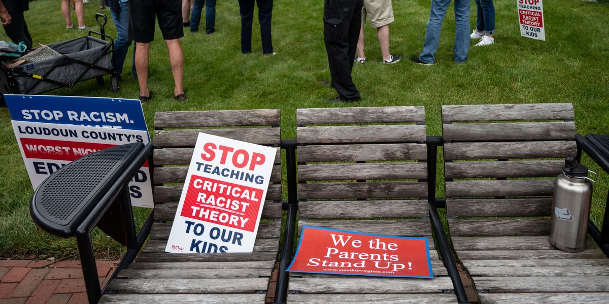 Signs at a rally against critical race theory
