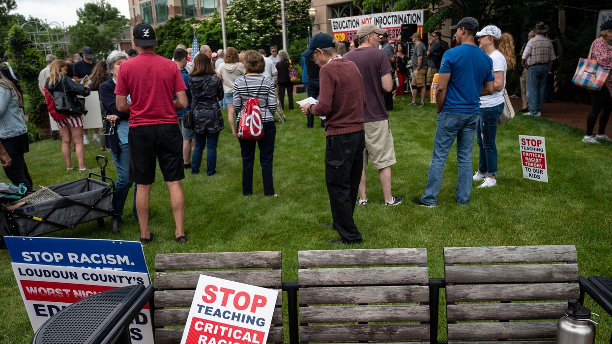 Signs at a rally against critical race theory