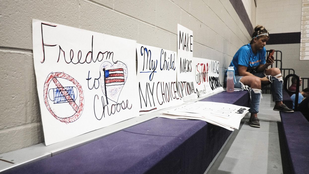 Signs protesting mask mandates