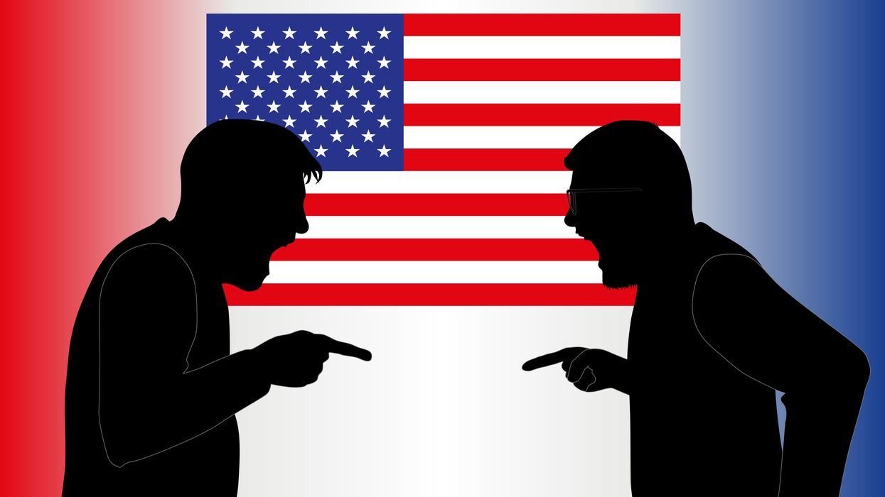 silhouettes of people arguing in front of an America flag