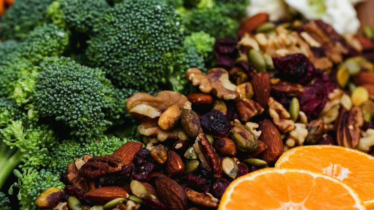 sliced orange fruit, nuts and green broccoli