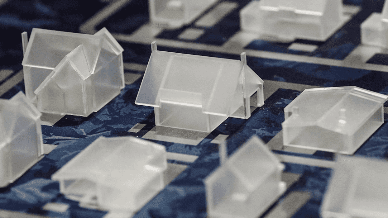 Small plastic models of homes.