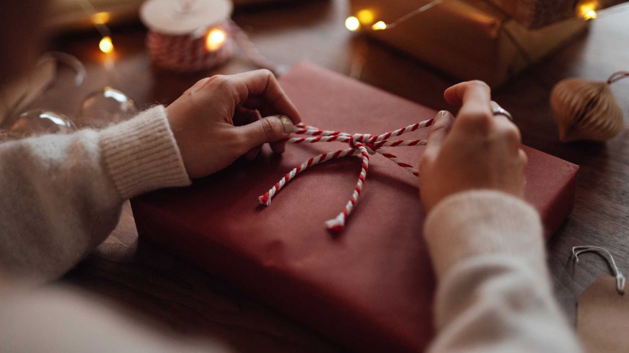Someone wrapping a gift.