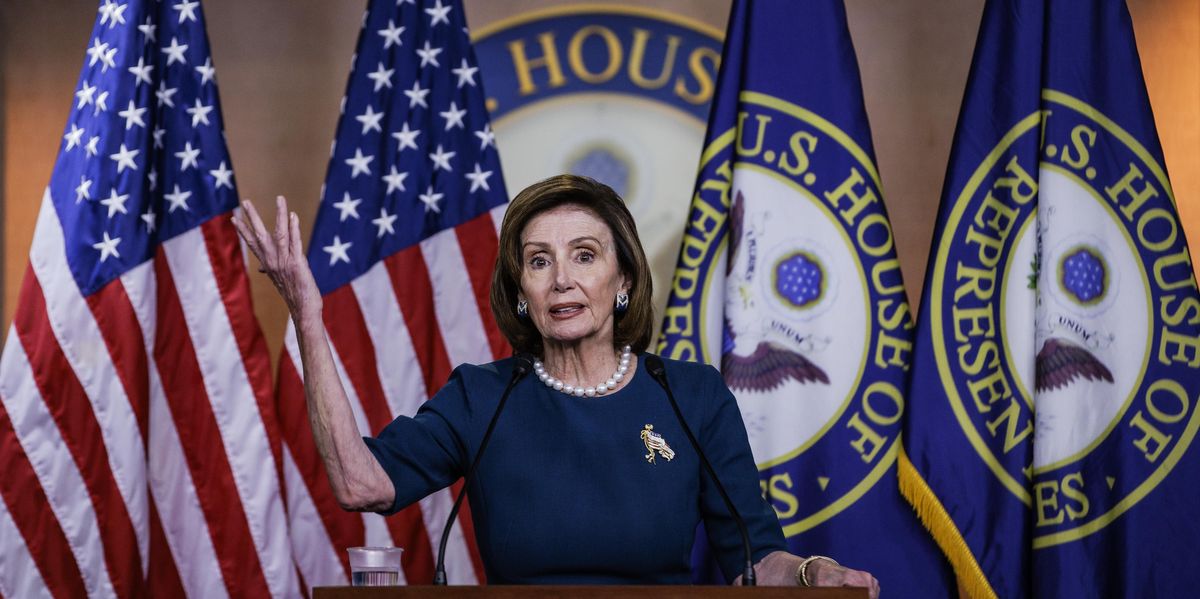 Speaker Nancy Pelosi at a podium