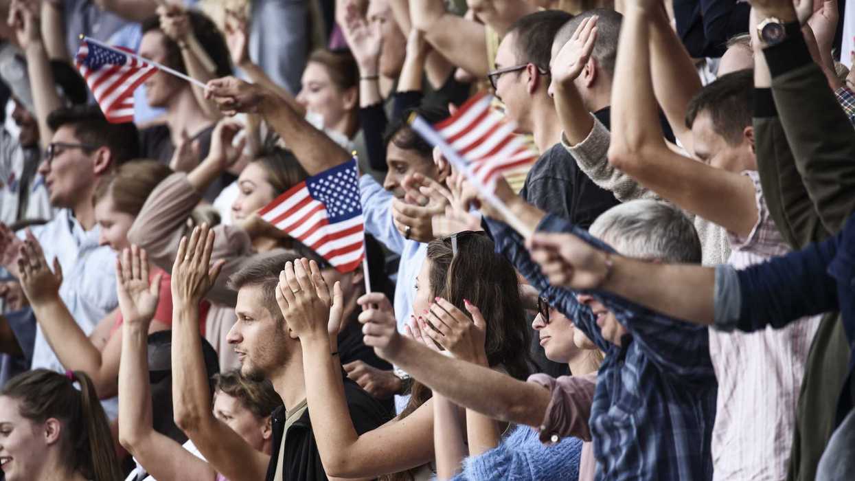 Spectators on a stadium with USA playing.