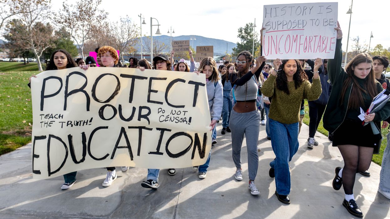Students marching with signs