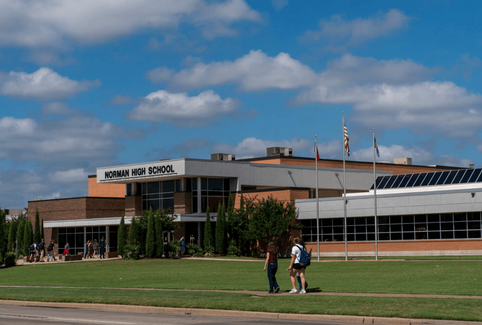 Students walk into Norman High School near Oklahoma City this fall
