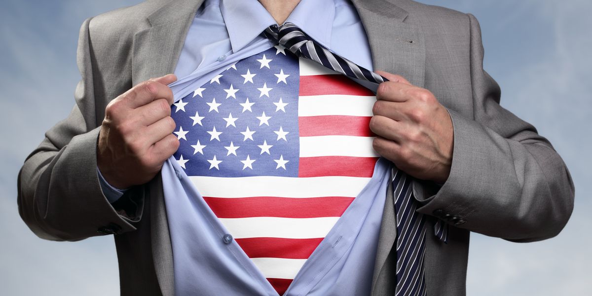 Superhero businessman revealing American flag