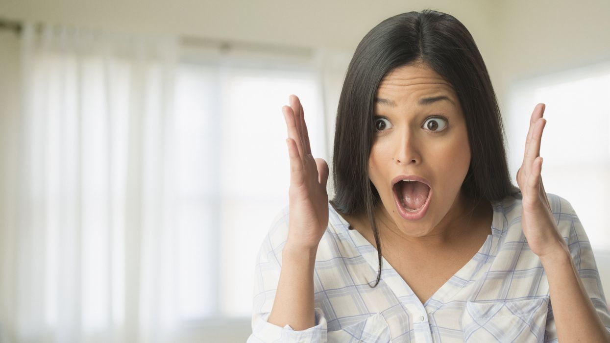 Surprised Hispanic woman