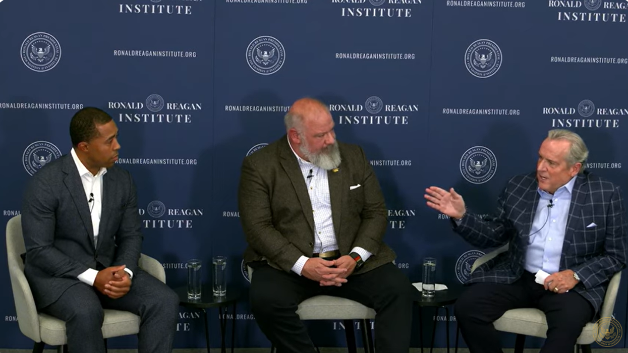 Three men in a panel discussion