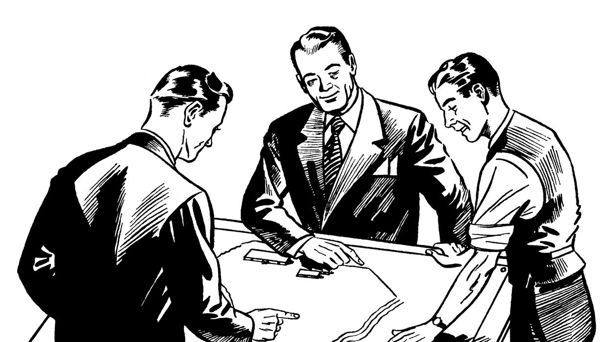 Three men looking at a map