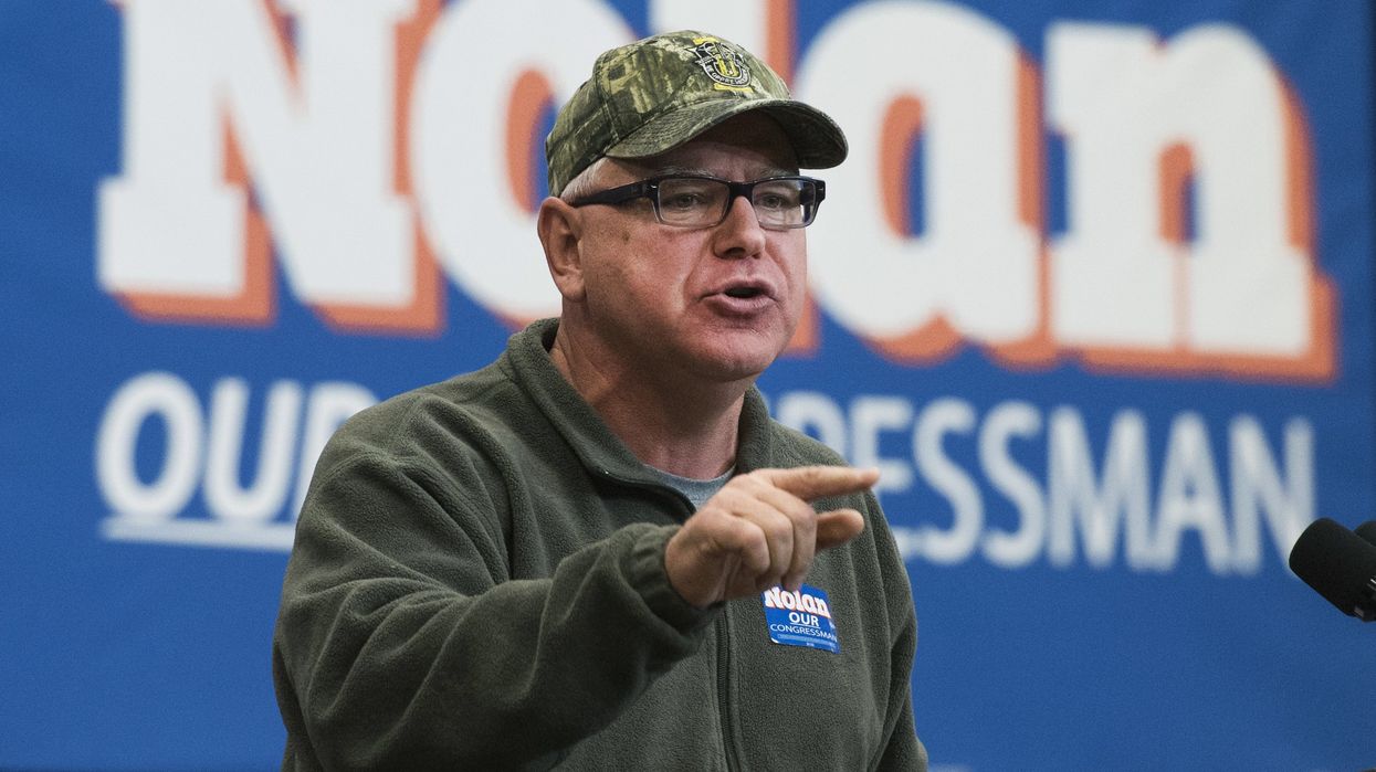 Tim Walz in a camo hat