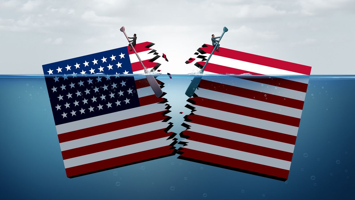 Torn American flag being pulled in two directions