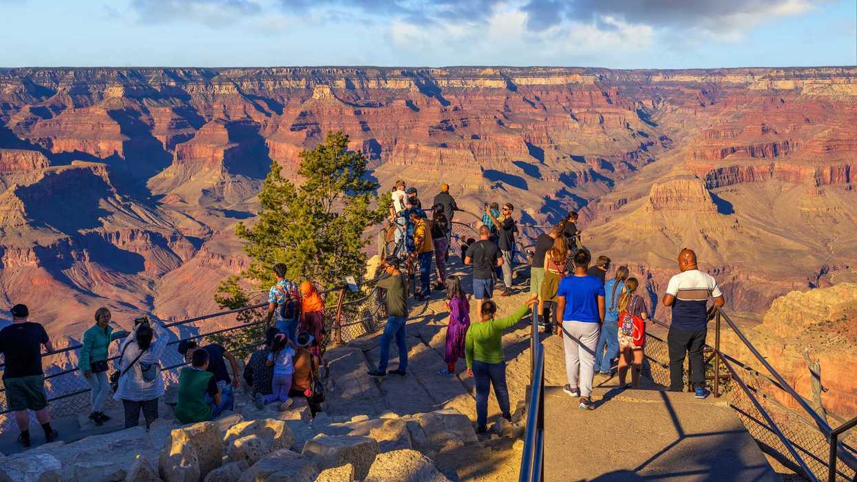 Tourists gather at Mather Point on the South Rim of the Grand Canyon, enjoying panoramic views of the iconic natural wonder