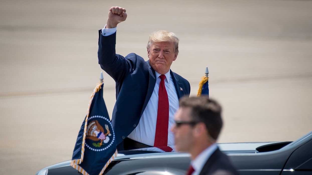 trump raises his fist