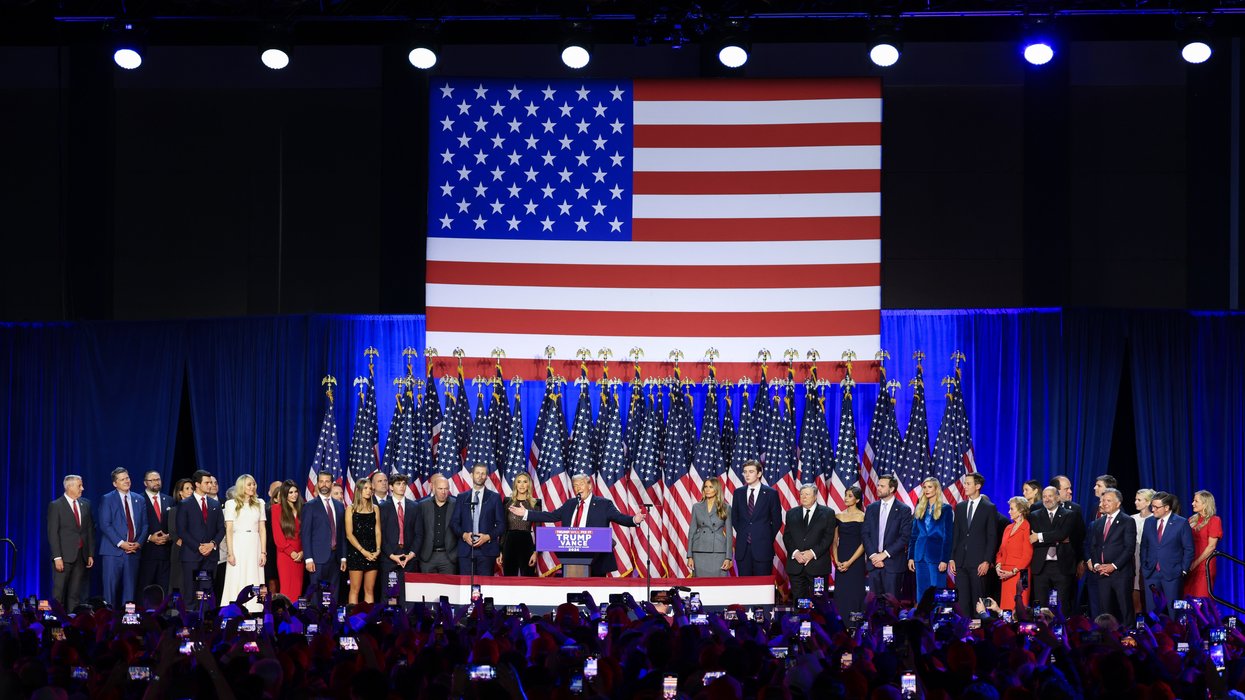 Trump speaking on a crowded stage
