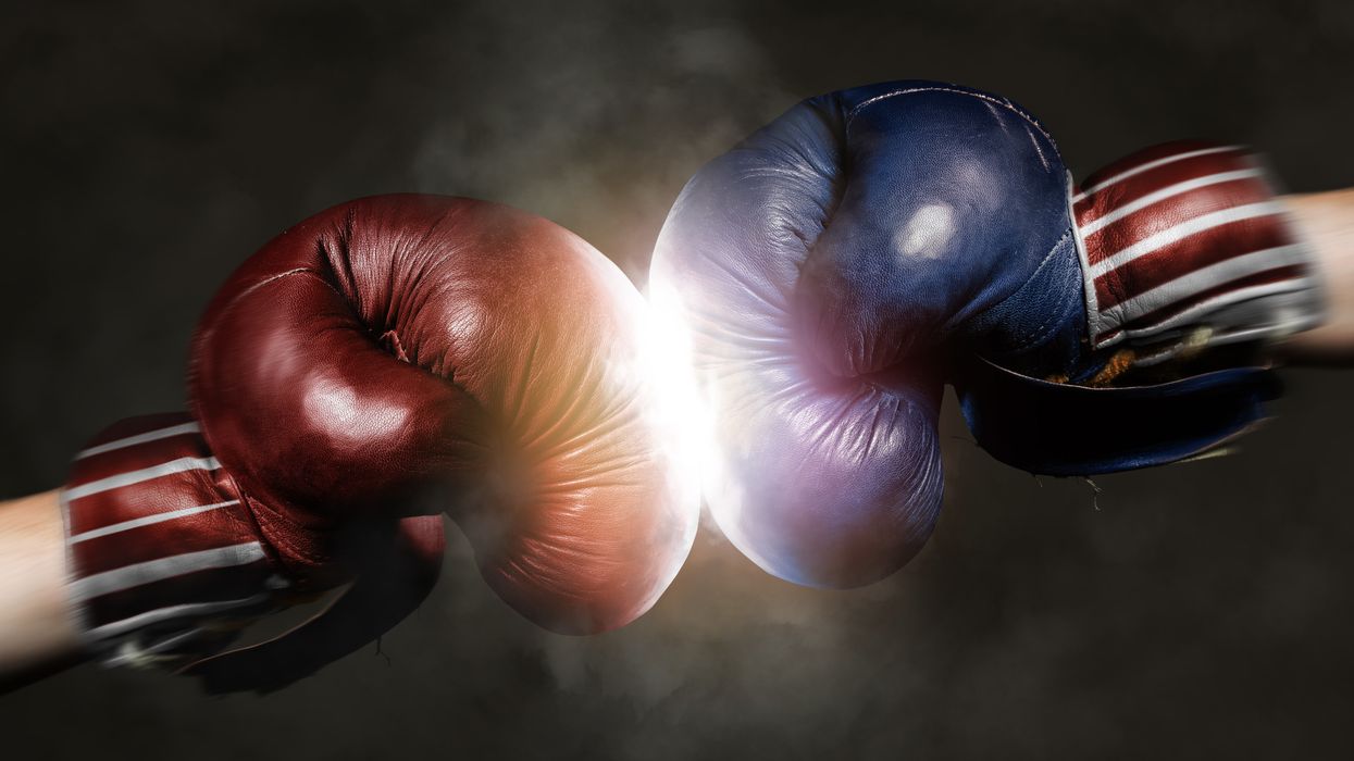 Two boxing gloves. One red and one blue.