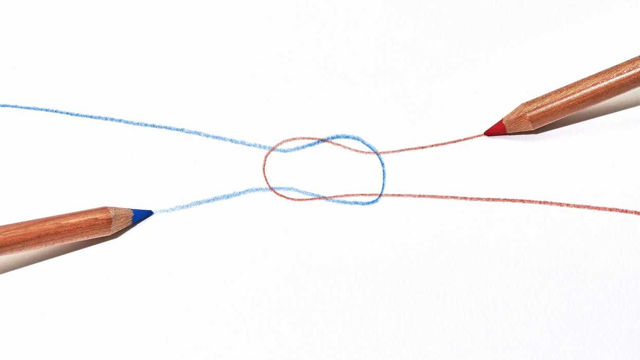 Two coloured pencils one red and one blue drawing a reef knot on a white paper background.