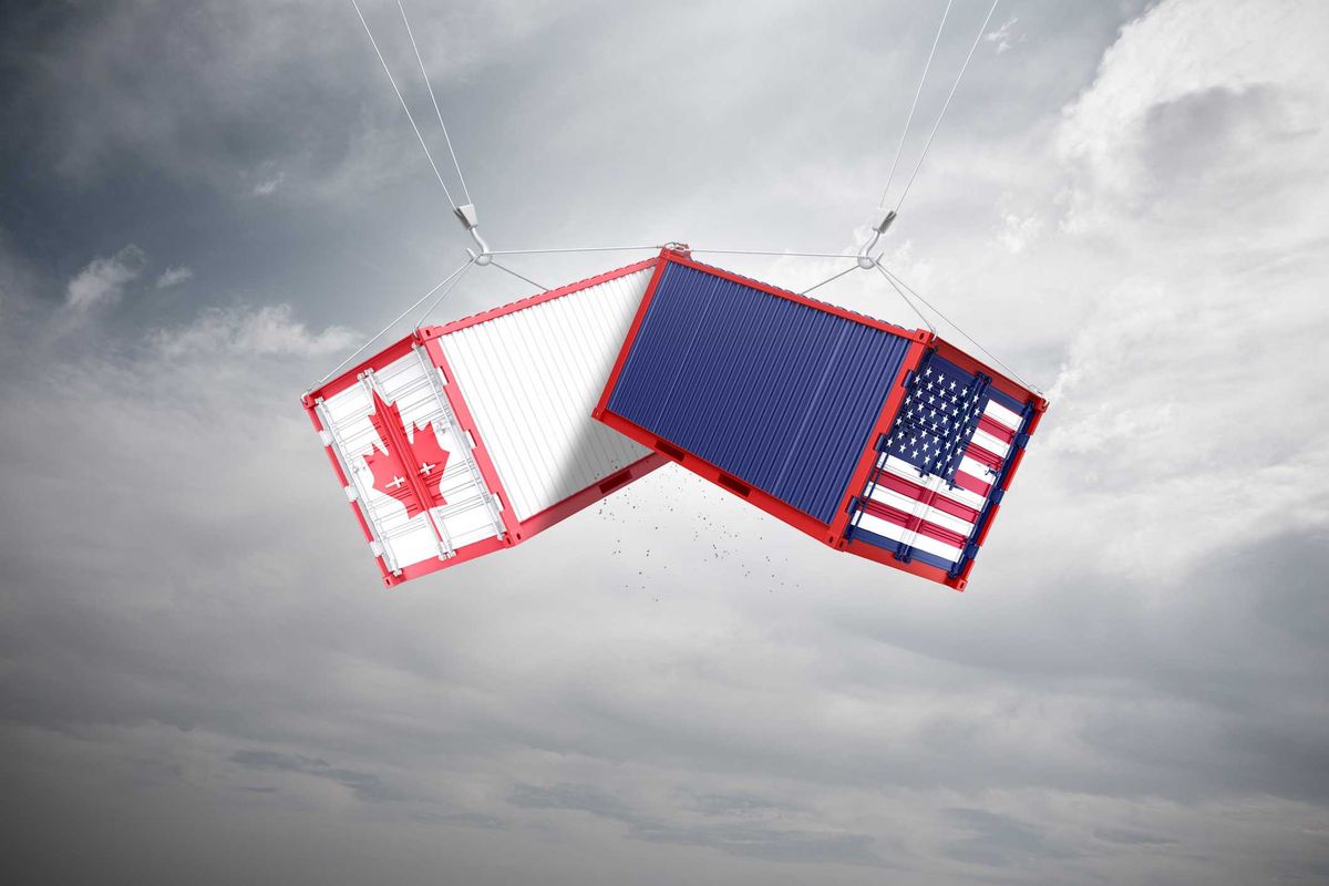 Two containers, one with a U.S. flag and another with Canada's flag.